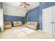 Spacious bonus room with two sofas and ceiling fan at 13618 Pacific Echo Dr, Charlotte, NC 28277