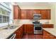 Kitchen features granite countertops and stainless steel appliances at 13618 Pacific Echo Dr, Charlotte, NC 28277