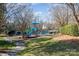 Community playground with slides, climbing structures, and shaded seating at 13618 Pacific Echo Dr, Charlotte, NC 28277