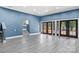 Finished basement with gray vinyl plank flooring and blue walls at 140 Kent Rd, Salisbury, NC 28147