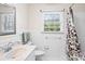 Bathroom with floral shower curtain and vanity at 140 Kent Rd, Salisbury, NC 28147