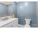 Elegant powder room with white vanity and gold accents at 140 Kent Rd, Salisbury, NC 28147