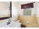 Clean bathroom featuring updated vanity and tiled walls at 140 Kent Rd, Salisbury, NC 28147