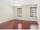 Simple bedroom with hardwood floors and two windows at 140 Kent Rd, Salisbury, NC 28147