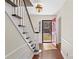 Front entry with hardwood floors, red door, and view of backyard at 140 Kent Rd, Salisbury, NC 28147