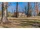 Brick home with mature trees and landscaping at 140 Kent Rd, Salisbury, NC 28147