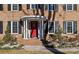 Welcoming front entrance with a red door and a classic portico at 140 Kent Rd, Salisbury, NC 28147