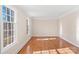 Spacious living room with hardwood floors and large windows at 140 Kent Rd, Salisbury, NC 28147