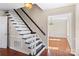 Elegant staircase with dark wood and white railings in the foyer at 140 Kent Rd, Salisbury, NC 28147