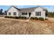 White house with gray shutters, front porch, and landscaping at 1409 Bicycle Ct, York, SC 29745