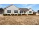 White house with gray shutters, front porch, and landscaping at 1409 Bicycle Ct, York, SC 29745