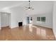 Bright living room featuring hardwood floors and a fireplace at 1409 Bicycle Ct, York, SC 29745