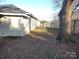 Large backyard with mature trees and privacy fence at 1443 Modena St, Gastonia, NC 28054