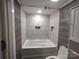 Updated bathroom with a tub/shower combination at 1443 Modena St, Gastonia, NC 28054