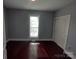 Bedroom with dark hardwood floors and a double door closet at 1443 Modena St, Gastonia, NC 28054