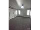 Spacious bedroom with gray carpeting and barn door at 1443 Modena St, Gastonia, NC 28054