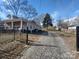 Gravel driveway and side view of charming house at 1443 Modena St, Gastonia, NC 28054