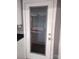 White door with gray framed glass window at 1443 Modena St, Gastonia, NC 28054