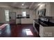 Modern white kitchen with stainless steel appliances at 1443 Modena St, Gastonia, NC 28054