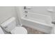 Clean white bathroom with a tub-shower combo and modern fixtures at 14812 Baytown Ct, Huntersville, NC 28078