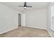 Bright bedroom with carpeted floors, a modern ceiling fan, and a window for natural light at 14812 Baytown Ct, Huntersville, NC 28078