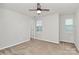 Neutral bedroom with carpet, ceiling fan, and natural light at 14812 Baytown Ct, Huntersville, NC 28078