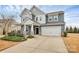 Charming two-story home with a two-car garage and a beautifully landscaped front yard at 14812 Baytown Ct, Huntersville, NC 28078