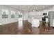 Bright kitchen with white cabinets, granite countertops, and stainless steel appliances at 14812 Baytown Ct, Huntersville, NC 28078