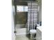 Clean bathroom with tub, toilet, and shower at 1825 Herrin Ave, Charlotte, NC 28205