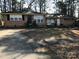 Brick ranch house with a large yard and driveway at 1825 Herrin Ave, Charlotte, NC 28205