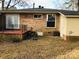 Brick house with deck and fenced backyard at 1825 Herrin Ave, Charlotte, NC 28205