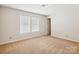 Bright bedroom with two windows and neutral carpeting at 2010 Durand Rd, Fort Mill, SC 29715