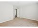 Simple bedroom with carpet, neutral walls, and a door at 2010 Durand Rd, Fort Mill, SC 29715