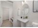 Powder room with pedestal sink and mirror at 2025 Tom Sadler Rd, Charlotte, NC 28214