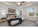 Main bedroom with ceiling fan and natural light at 2025 Tom Sadler Rd, Charlotte, NC 28214