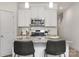 Modern kitchen with white cabinets, granite countertops and island at 2025 Tom Sadler Rd, Charlotte, NC 28214