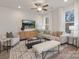 Bright living room features a neutral color palette, comfortable seating, and large windows at 2025 Tom Sadler Rd, Charlotte, NC 28214