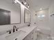 Modern bathroom with double vanity, large mirror, and updated fixtures at 2039 Renner St, Charlotte, NC 28216