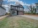 Two-story modern home with gray siding and a spacious lawn at 2039 Renner St, Charlotte, NC 28216