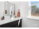 Modern bathroom with black vanity, white countertop, and marble shower at 2041 Greenoak Dr, Shelby, NC 28152