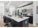 Modern kitchen with white and dark cabinets, quartz countertops, and an island with seating at 2041 Greenoak Dr, Shelby, NC 28152