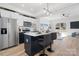 Modern kitchen with white and dark cabinets, quartz countertops, and an island with seating at 2041 Greenoak Dr, Shelby, NC 28152