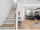 Elegant staircase leading to an open concept kitchen with island at 2041 Greenoak Dr, Shelby, NC 28152