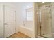 Bathroom features a soaking tub, walk-in shower, and tile flooring at 2131 Ashley Glen Way, Fort Mill, SC 29707