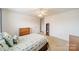 Bright bedroom with carpeted floors and double doors leading to a closet at 2131 Ashley Glen Way, Indian Land, SC 29707