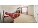 Serene bedroom with a wooden bed frame and floral bedding at 2131 Ashley Glen Way, Fort Mill, SC 29707