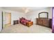 Spacious bedroom with a wooden bed frame and chest of drawers at 2131 Ashley Glen Way, Fort Mill, SC 29707