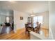 Formal dining room with hardwood floors, a dark wood table, and a china cabinet at 2131 Ashley Glen Way, Fort Mill, SC 29707