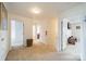 Upstairs hallway with carpet, doors to bedrooms, and a wicker basket at 2131 Ashley Glen Way, Fort Mill, SC 29707