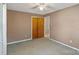 Bedroom with ceiling fan and double-door closet at 214 Costner Dr, Bessemer City, NC 28016